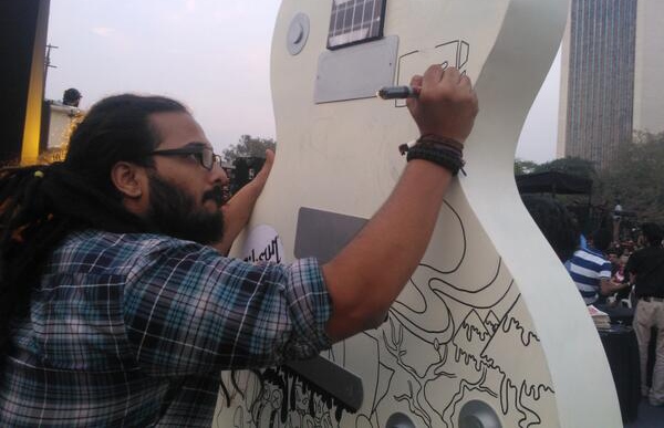 Providence drummer Aaron Pinto working on the MTV ACT GuitART Installation